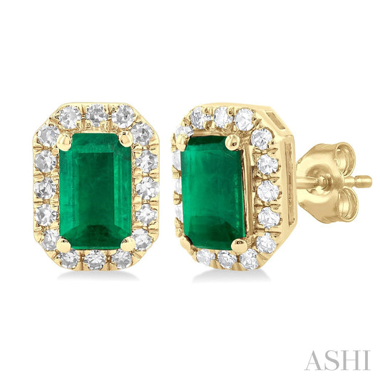 Emerald stud earrings with diamond halo.