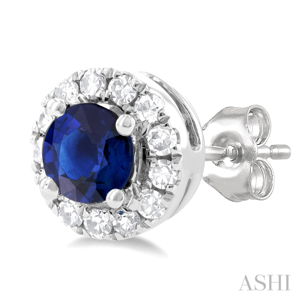 Sapphire stud earrings with diamond halo.