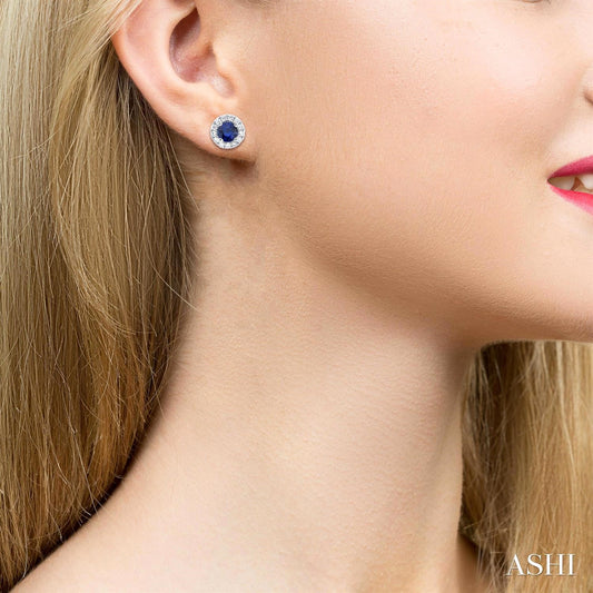 Sapphire stud earrings with diamond halo.