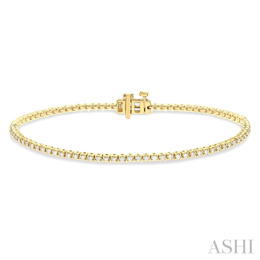 Yellow gold diamond tennis bracelet with clasp.