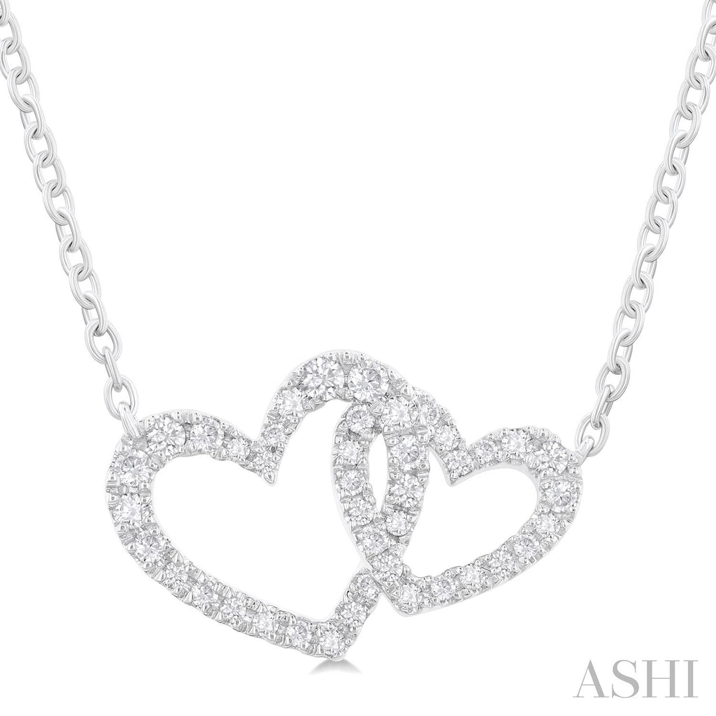 Interlocking diamond heart necklace in white gold.