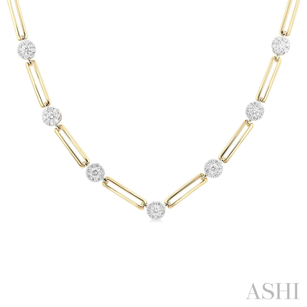 Diamond necklace with gold paperclip chain.