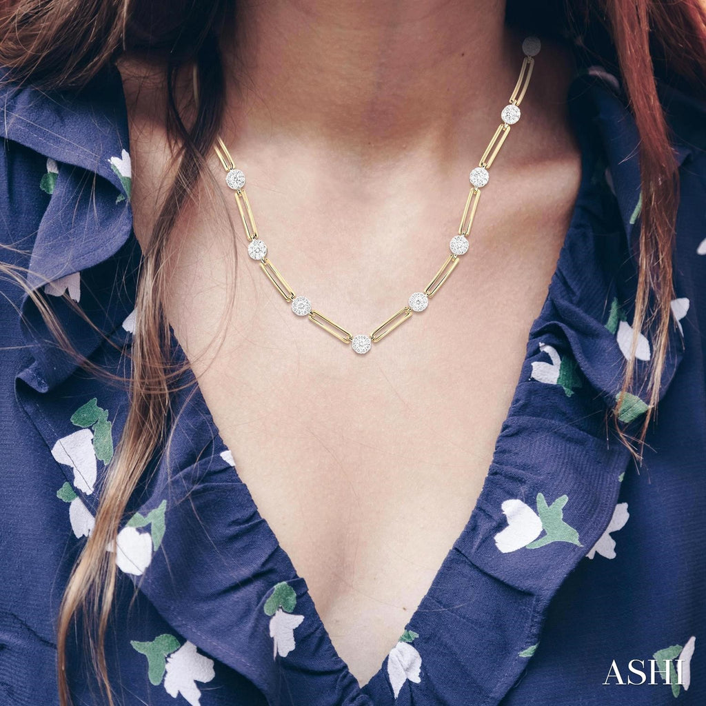 14K gold necklace with round diamonds.