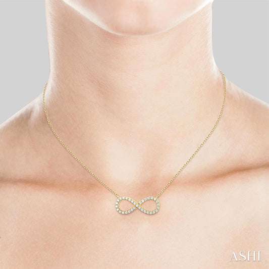 Infinity-shaped diamond necklace in yellow gold.