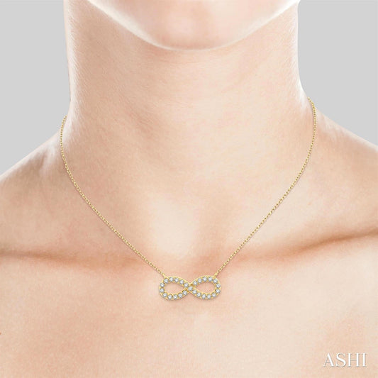 Infinity diamond necklace on gold chain.