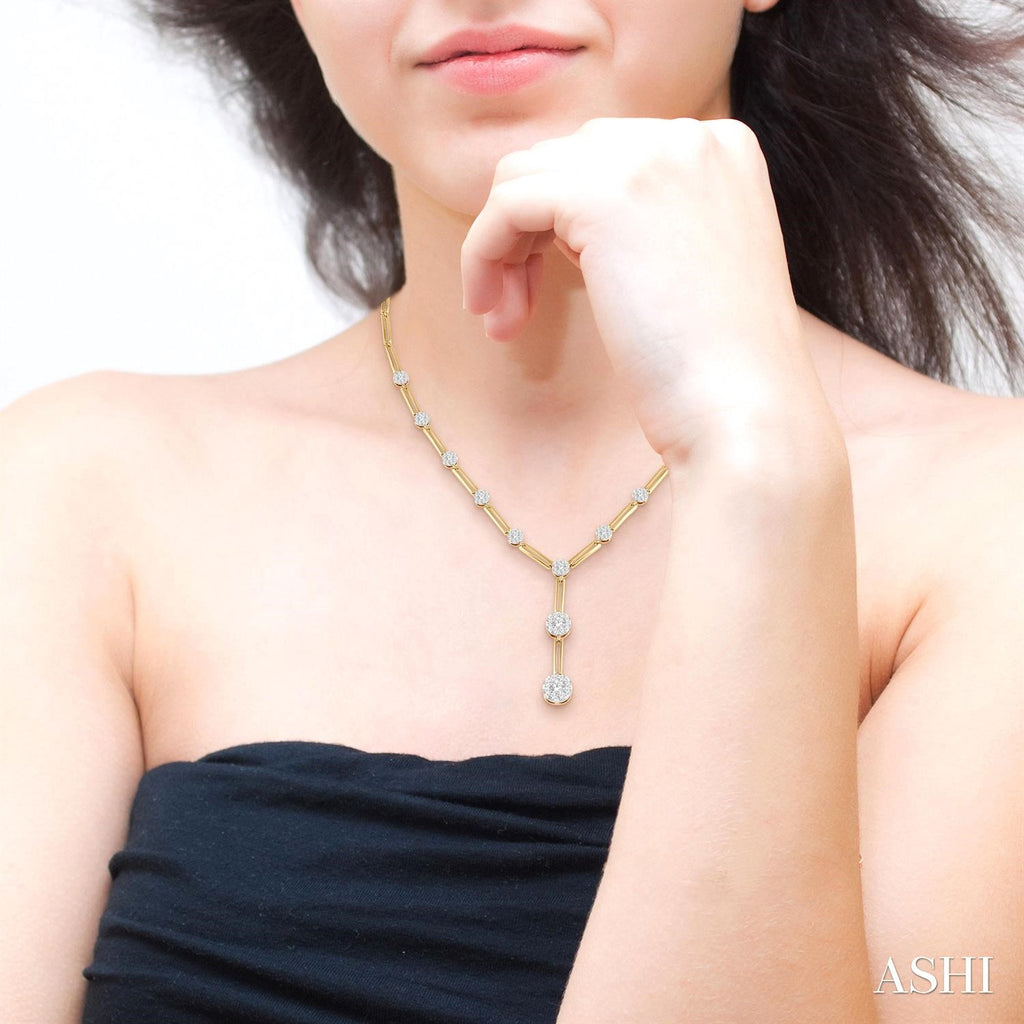 Diamond necklace with gold paperclip chain.