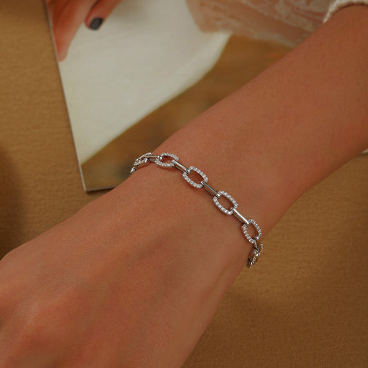 Simulated diamond bracelet on wrist.