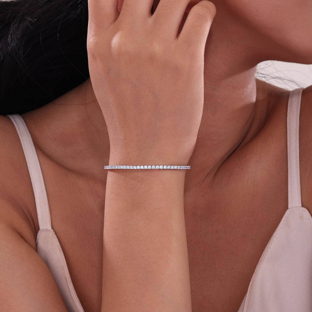 Simulated diamond bangle on woman's wrist.