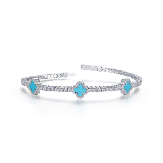 Platinum bangle with turquoise clover accents.