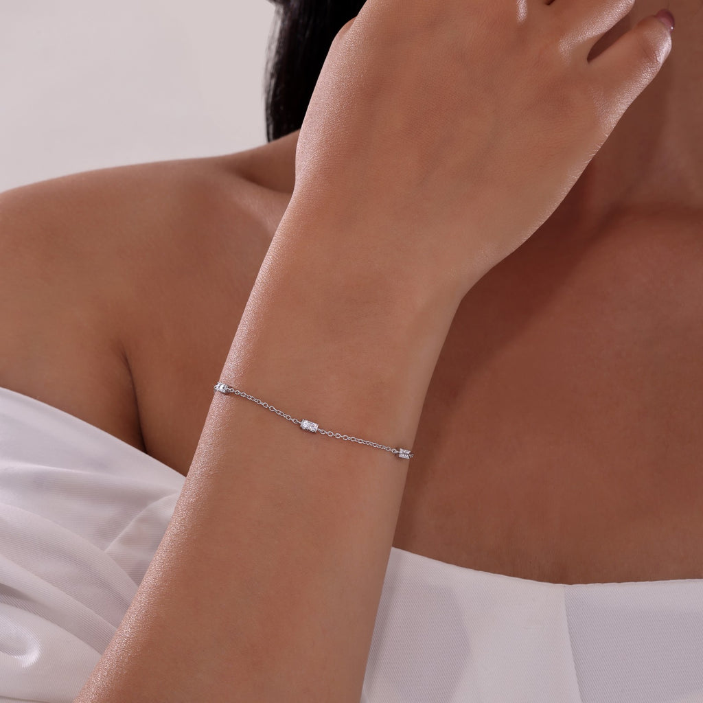 Platinum bracelet with round simulated diamonds.