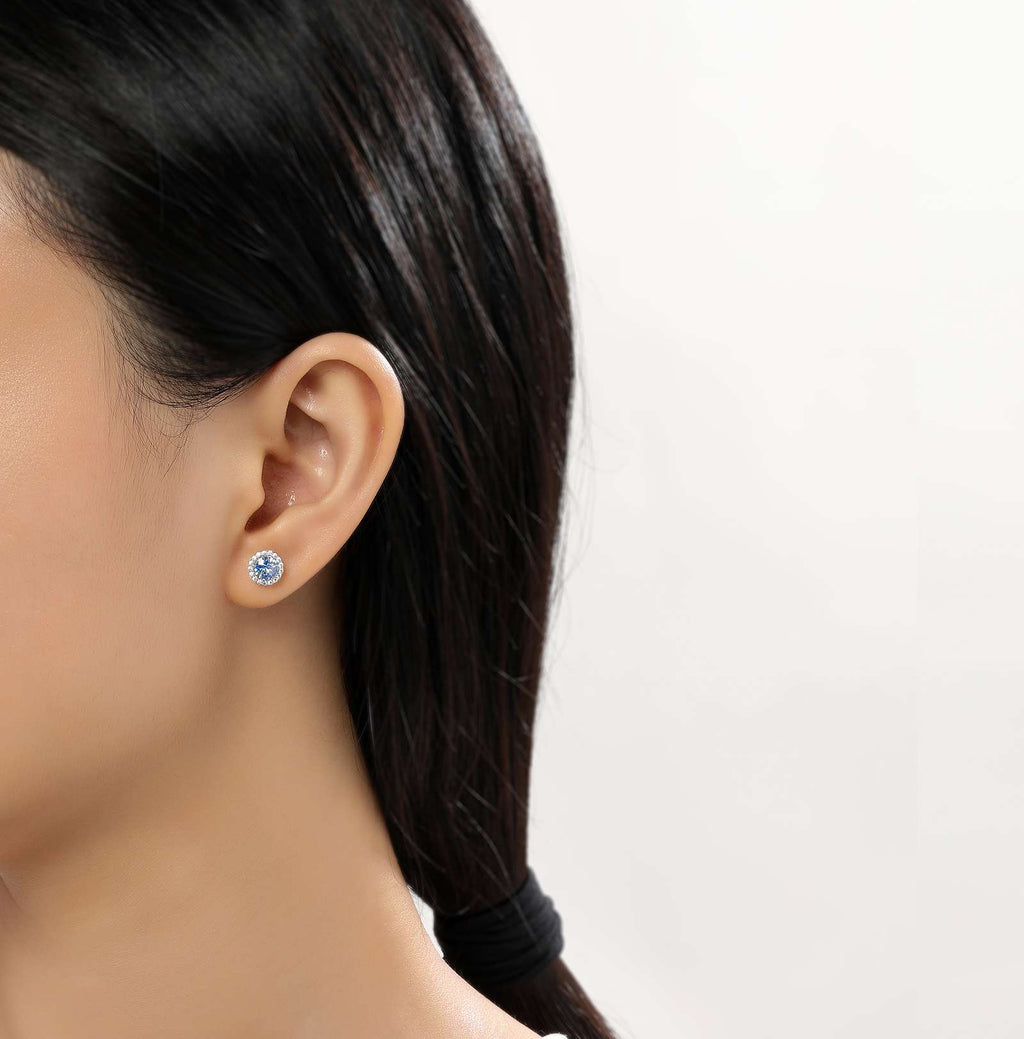 Simulated aquamarine stud earrings in silver.