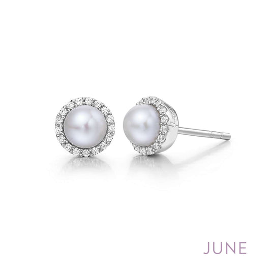 White pearl earrings with diamond halo.