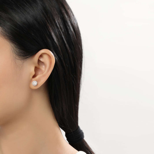 Pearl and diamond stud earrings.