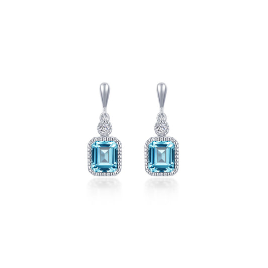 Emerald-cut aquamarine earrings with round diamonds.