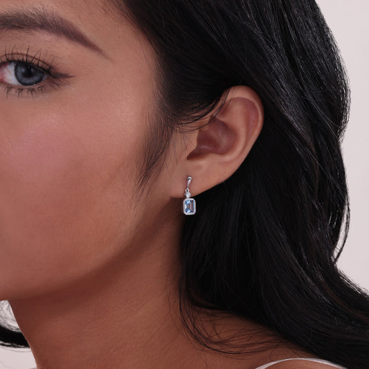 Emerald-cut aquamarine earrings with diamonds.