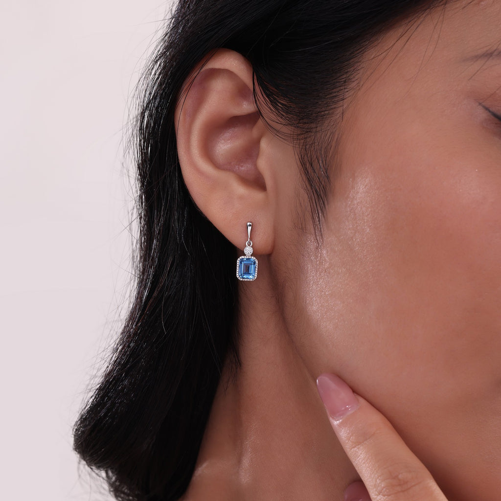 Emerald-cut blue topaz earrings.