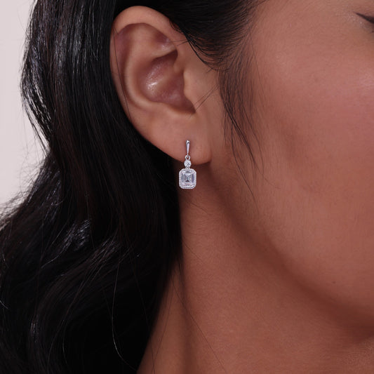 Simulated diamond dangle earrings in platinum silver.