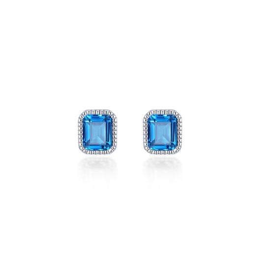 Emerald-cut blue topaz stud earrings.