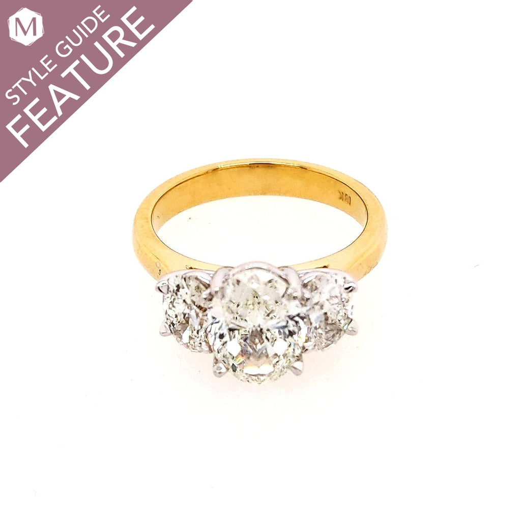 Three-stone oval diamond ring, yellow gold.