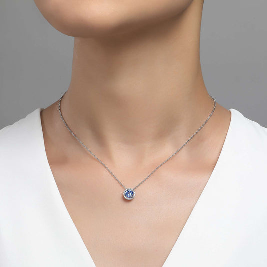 Simulated aquamarine pendant on silver chain.