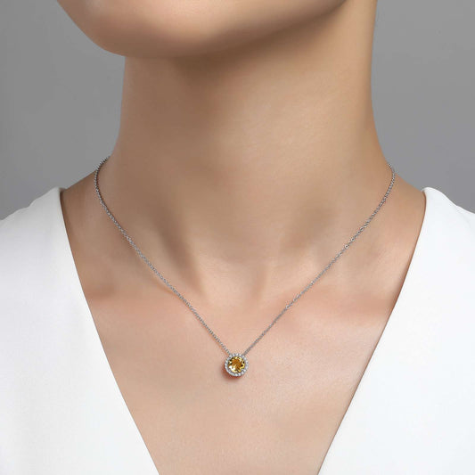 Citrine pendant on silver chain necklace.