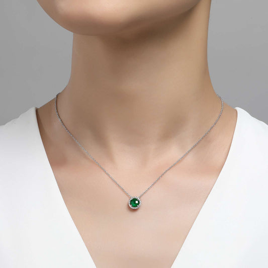 Simulated emerald pendant on silver chain.