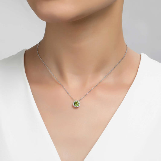 Round peridot pendant on silver chain.