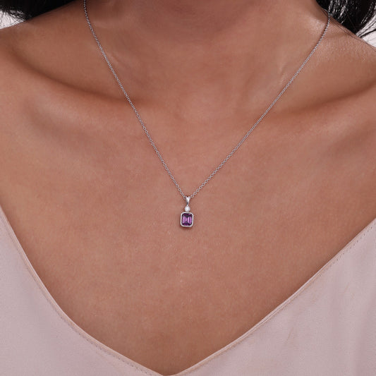 Emerald-cut alexandrite pendant necklace.