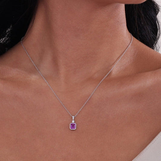 Pink tourmaline pendant on silver chain.