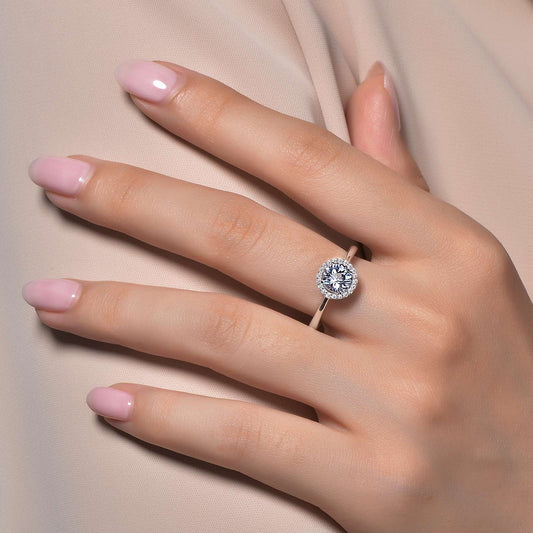 Simulated aquamarine ring on hand.