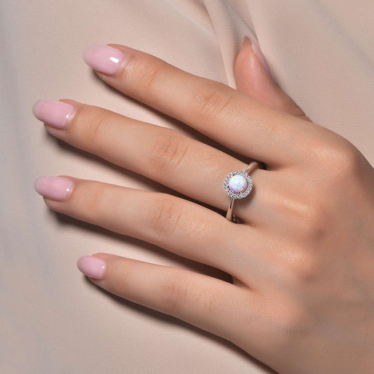 White opal ring with simulated diamonds.