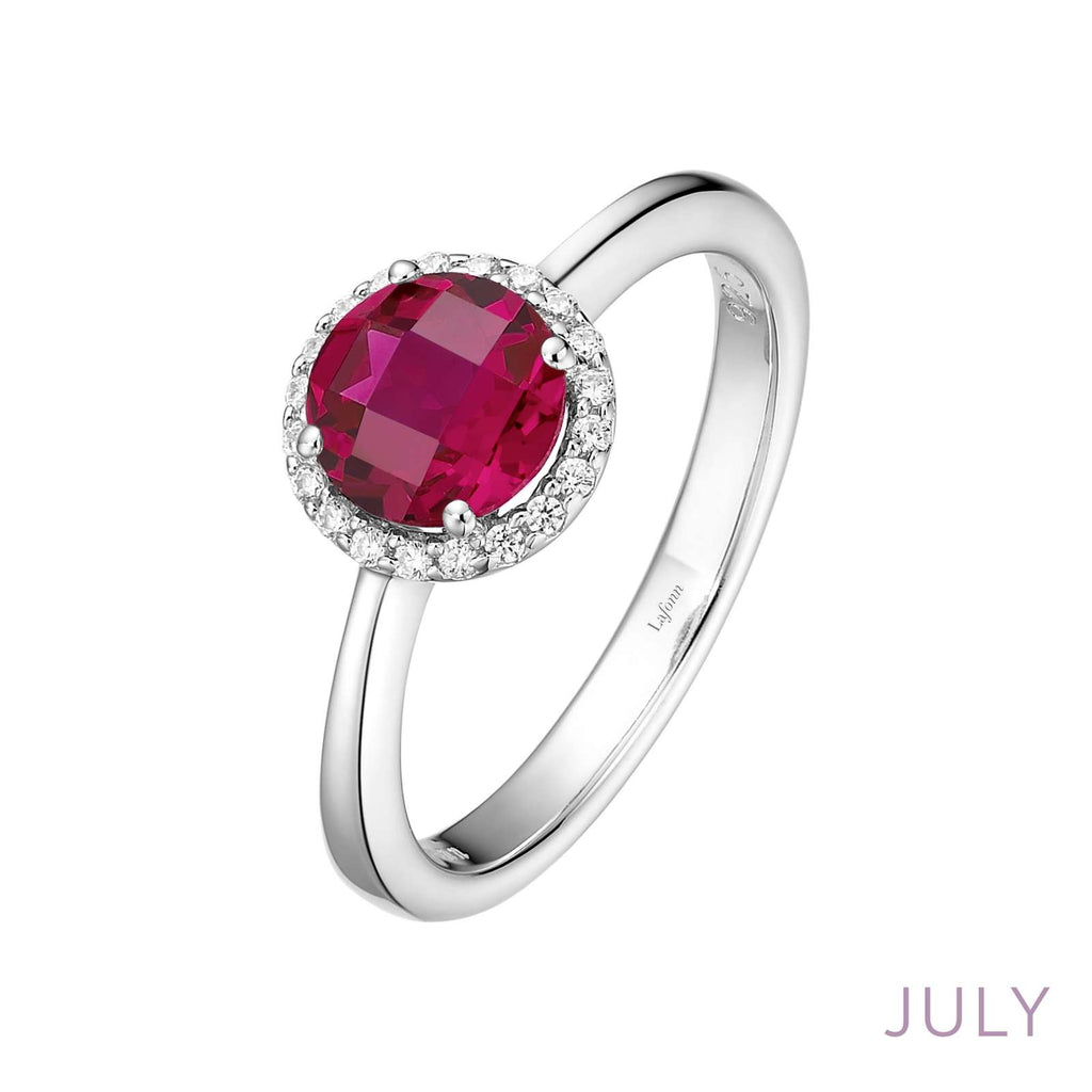 Platinum ring with red gemstone centerpiece.