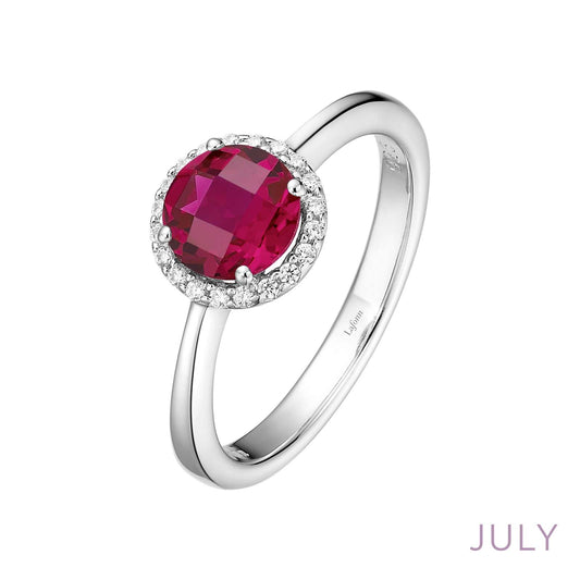 Platinum ring with red gemstone centerpiece.
