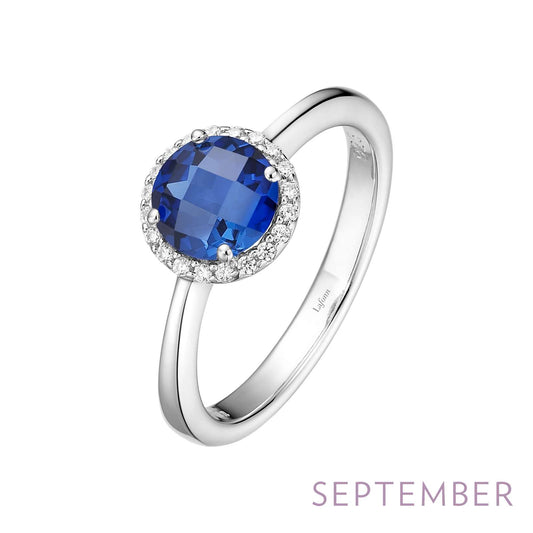 Round blue sapphire ring in silver.