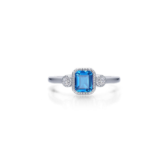 Emerald-cut blue topaz ring with diamonds.