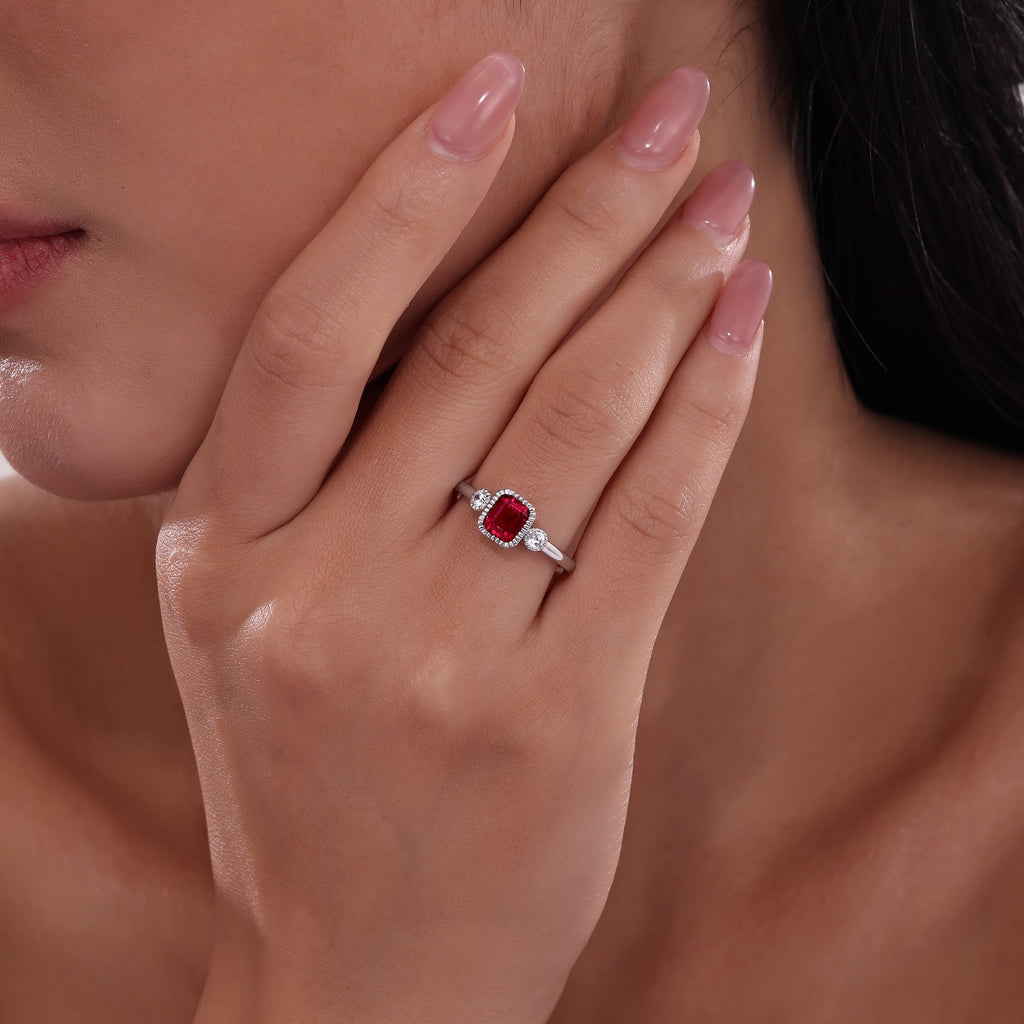 Emerald simulated garnet ring with diamonds.