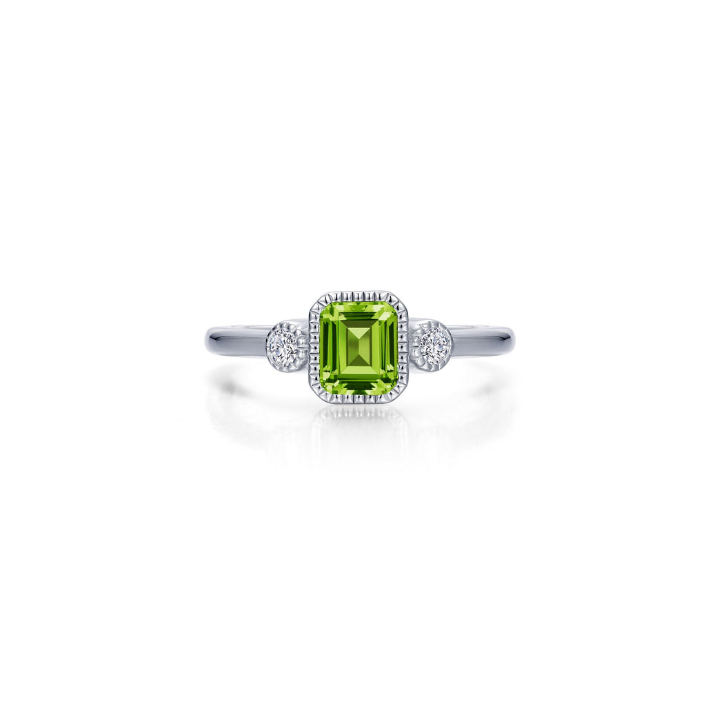Emerald-cut peridot ring with diamond accents.