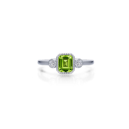 Emerald-cut peridot ring with diamond accents.