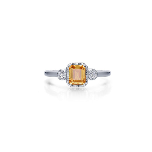 Emerald-cut citrine ring with round accents.