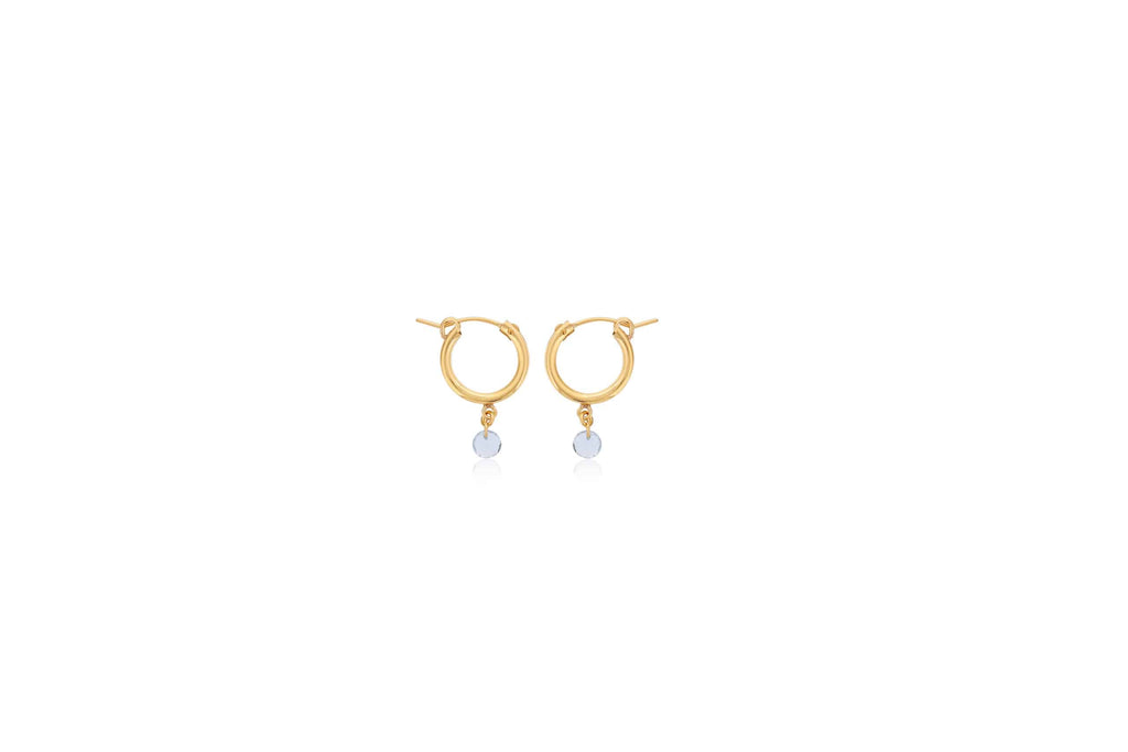 Gold hoops with dangling aquamarine gemstones.