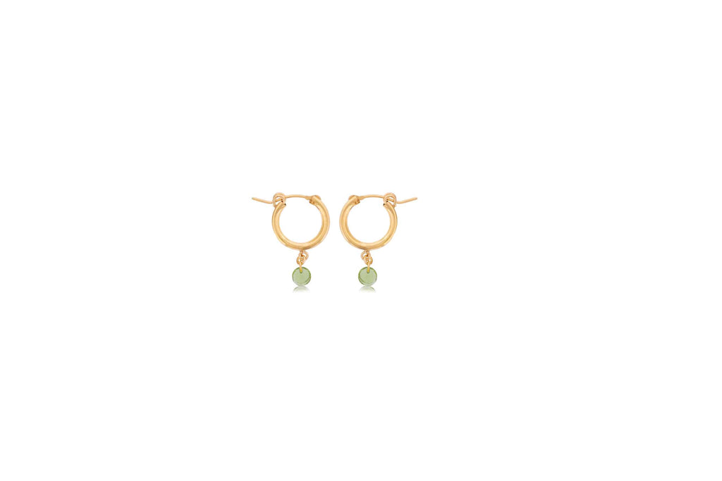 Gold hoops with dangling green peridot stones.