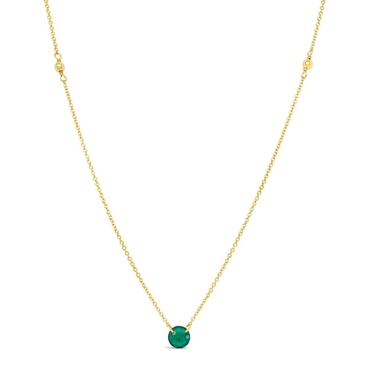 Gold necklace with round emerald pendant.