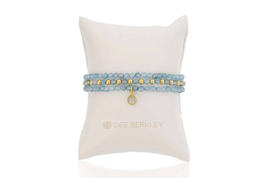 Blue topaz bracelet with gold accents.