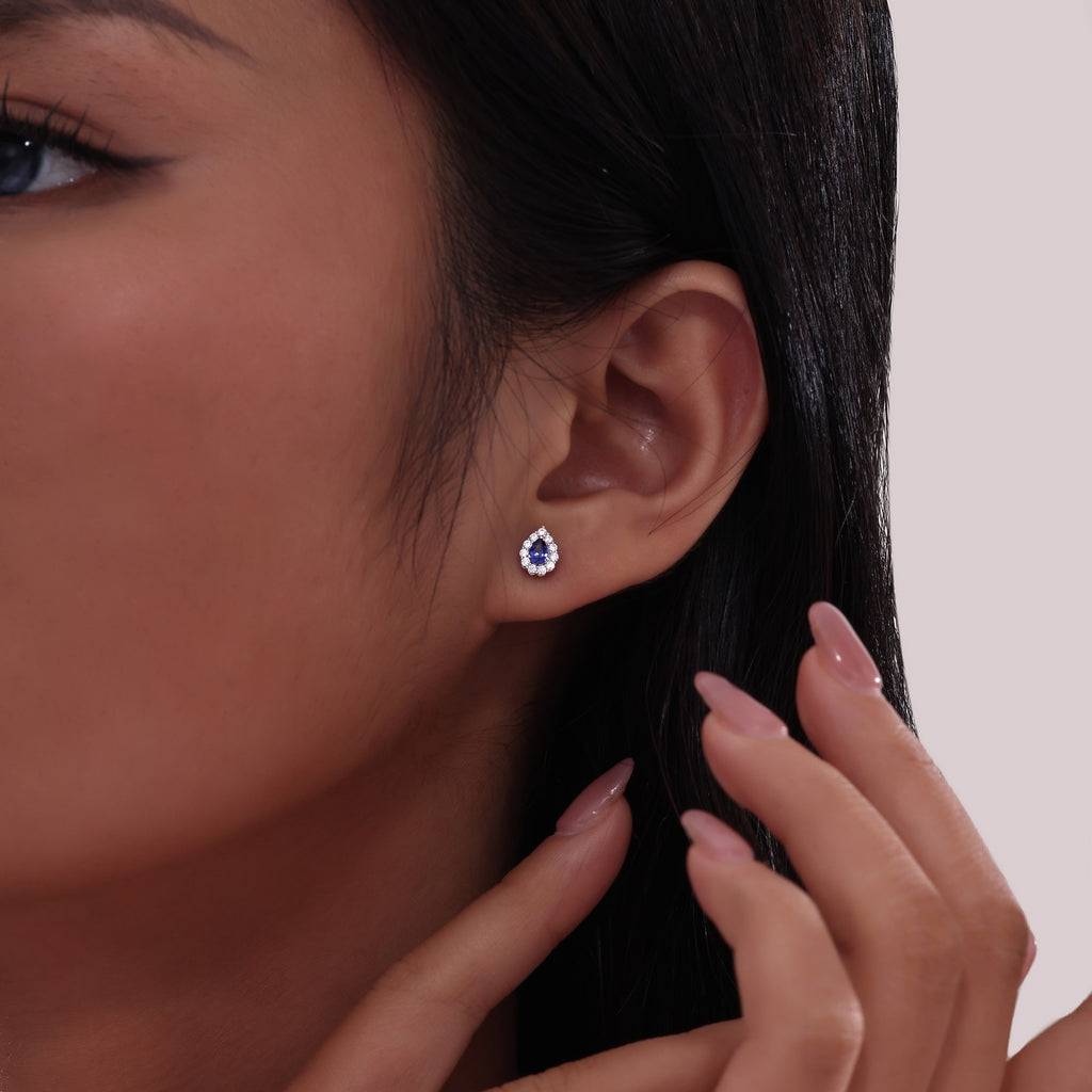 Pear-shaped sapphire earrings with diamond accents.