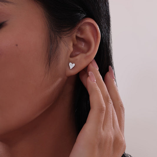 Heart-shaped simulated diamond earrings in silver.