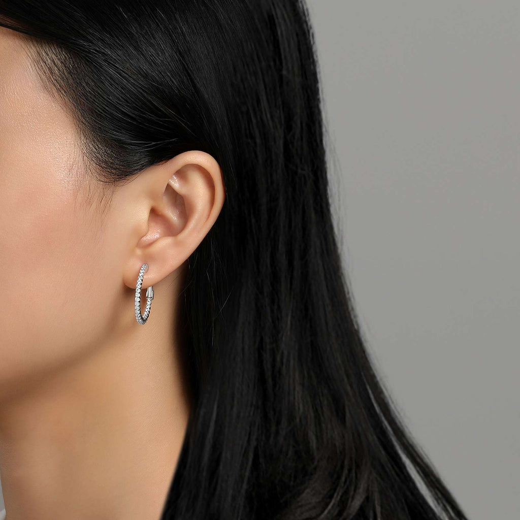 Medium hoop earrings with simulated diamonds.