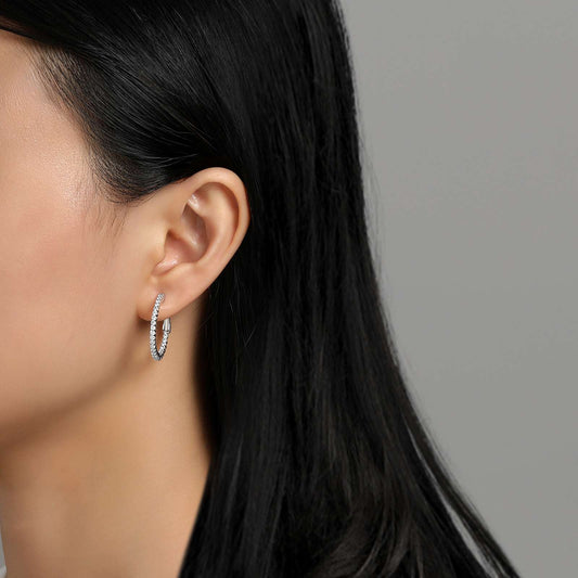 Medium hoop earrings with simulated diamonds.