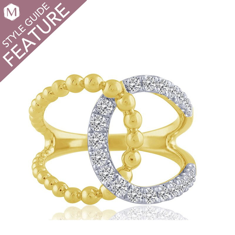 Yellow gold ring with round diamond accents.