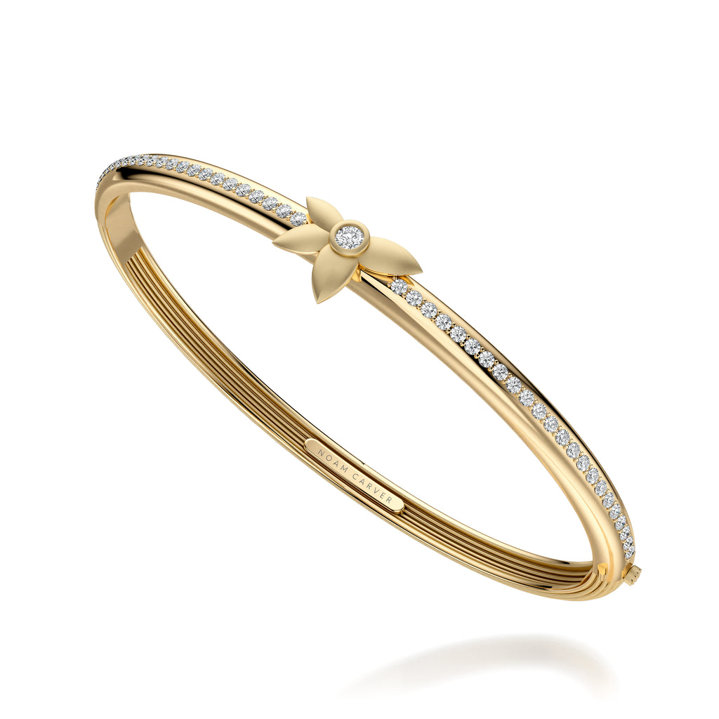 Yellow gold bracelet with round diamonds.
