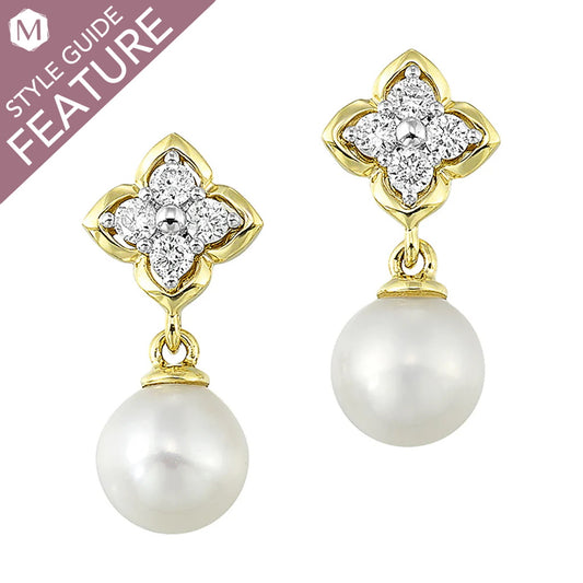Dangle earrings with pearls and diamond clusters.